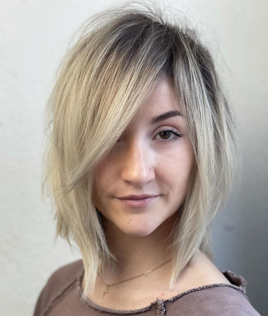 Angled Side Bangs with Root Fade